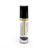 Crown Chakra roller bottle showing back of label and amethyst crystals. Soul Ritual charka roller collection for crown chakra infused with reiki, amethyst crystals, and essential oils for your energetic well-being,