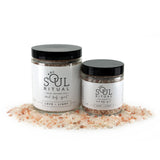 Love and Light soaking salts is a self-care product by Soul Ritual infused with reiki, therapeutic salts and colloidal oatmeal for energy balancing for sensitive skin. Love and Light pink Himalayan soaking salts are deeply calming and nurturing, perfect for balancing your emotions and comforting your soul. Jar of pink Himalayan bath salts.