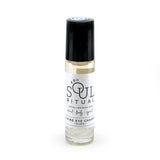 Third Eye Chakra roller bottle showing label and crushed clear quartz gemstones. Soul Ritual chakra roller bottle collection for Third Eye chakra infused with reiki, clear quartz and chakra essential oil blend for your energetic well-being.