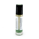 Heart Chakra roller bottle showing back of label and green aventurine crystals. Soul Ritual chakra roller bottle collection for heart chakra infused with reiki, green aventurine crystals, and chakra essential oil blend for your energetic well-being,