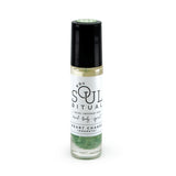 Heart Chakra roller bottle showing label and green aventurine crystals. Soul Ritual chakra roller bottle collection for heart chakra infused with reiki, green aventurine crystals, and chakra essential oil blend for your energetic well-being,