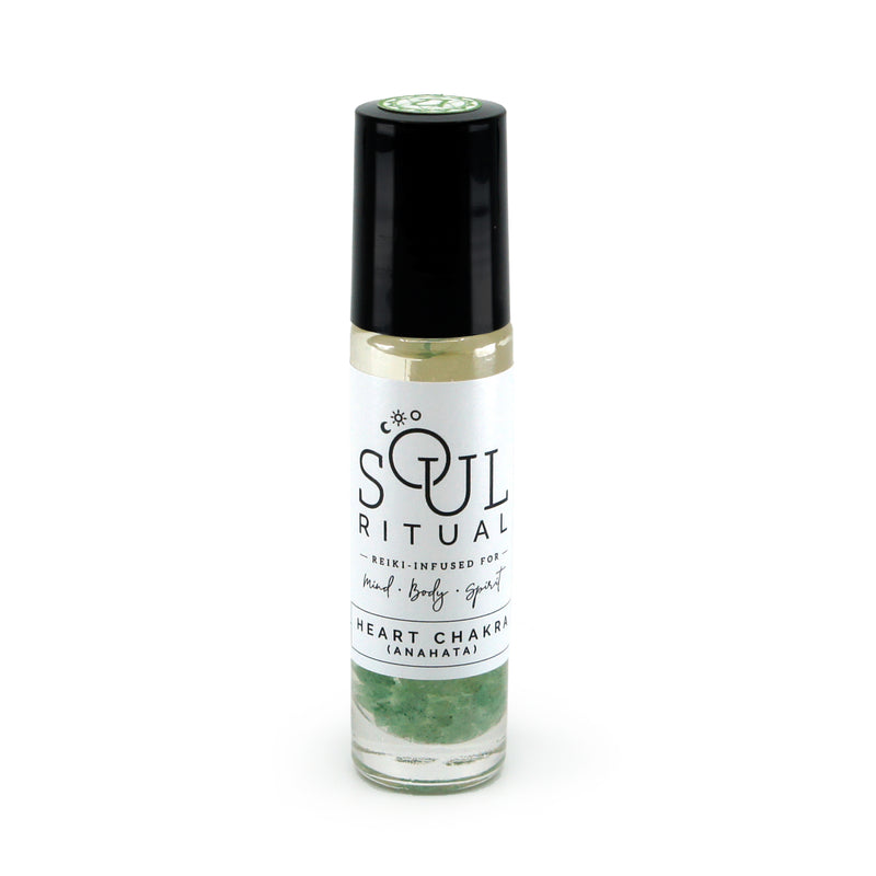 Heart Chakra roller bottle showing label and green aventurine crystals. Soul Ritual chakra roller bottle collection for heart chakra infused with reiki, green aventurine crystals, and chakra essential oil blend for your energetic well-being,