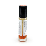 Sacral Chakra roller bottle showing label and crushed carnelian gemstones. Soul Ritual chakra roller bottle collection for sacral chakra infused with reiki, carnelian and chakra essential oil blend for your energetic well-being.