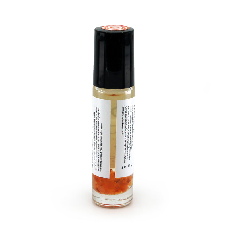 Sacral Chakra roller bottle showing label and crushed carnelian gemstones. Soul Ritual chakra roller bottle collection for sacral chakra infused with reiki, carnelian and chakra essential oil blend for your energetic well-being.