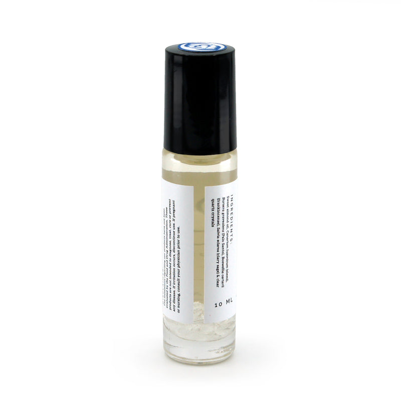 Third Eye Chakra roller bottle showing back of roller bottle and crushed clear quartz gemstones. Soul Ritual chakra roller bottle collection for Third Eye chakra infused with reiki, clear quartz and chakra essential oil blend for your energetic well-being.